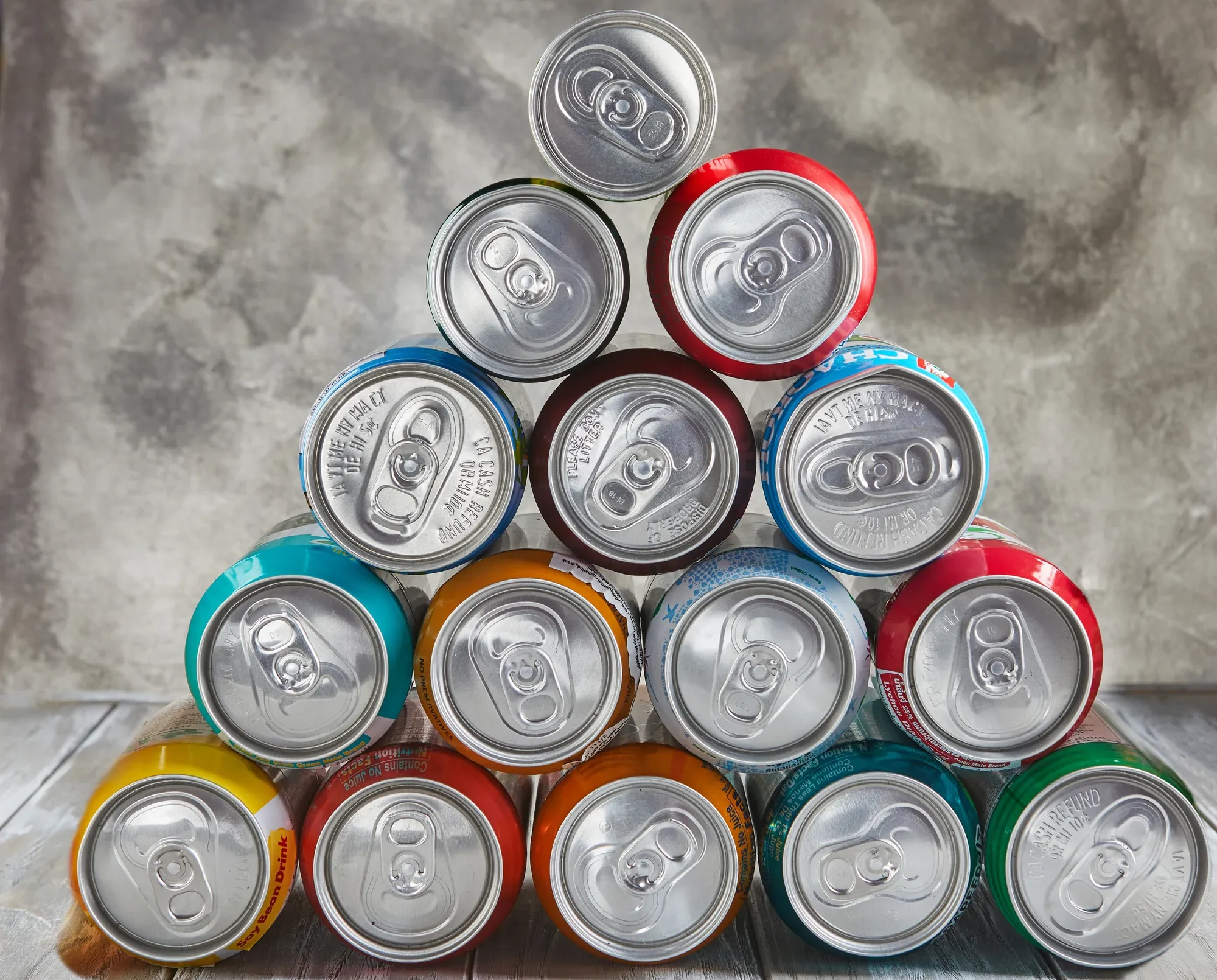Merxally drinks-in-cans-stacked-in-a-pyramid-on-the-table-image